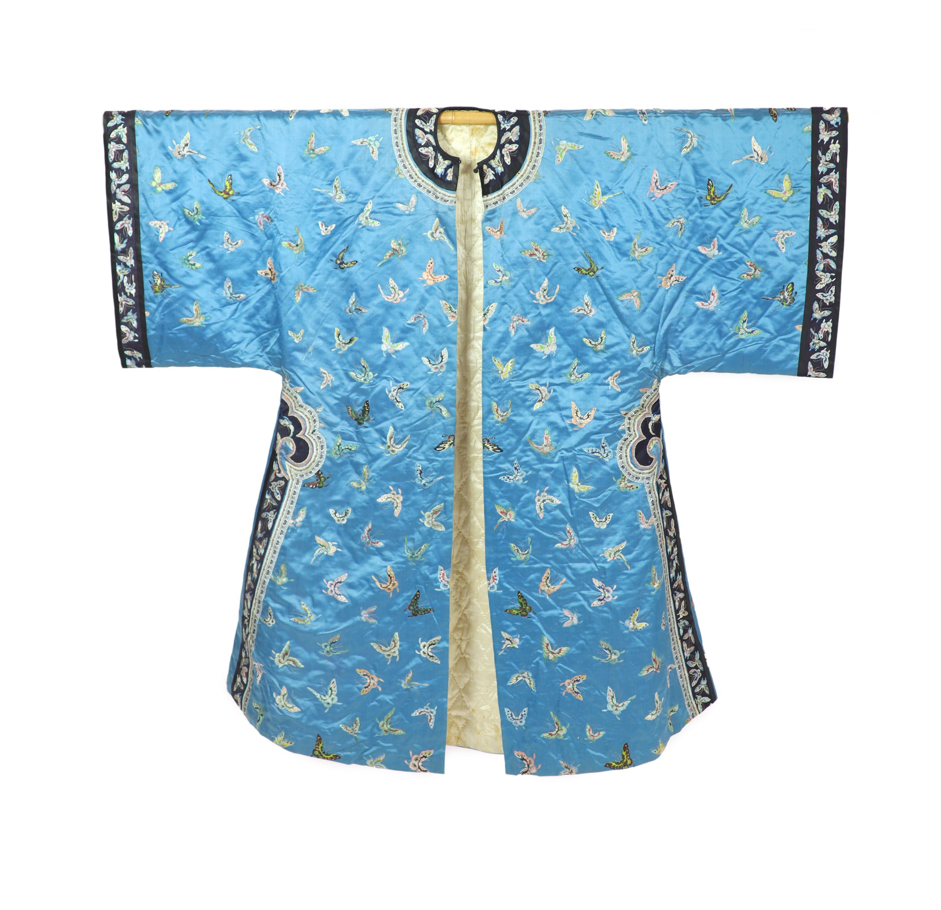 A Chinese blue silk ‘butterfly’ Winter robe, late 19th century, 132cm drop